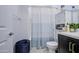 Bathroom showcasing a shower-tub combination, toilet, vanity, and built-in storage at 4507 S 119Th Dr, Avondale, AZ 85323