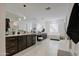 Well-lit bathroom with dual sinks, soaking tub, glass shower, and ample storage at 4507 S 119Th Dr, Avondale, AZ 85323