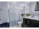 Well-lit bathroom with updated fixtures, a shower-tub, cabinet storage and modern design at 4507 S 119Th Dr, Avondale, AZ 85323