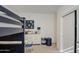 Bedroom with bunk bed, dresser, and closet offers practical storage and a fun, organized living space at 4507 S 119Th Dr, Avondale, AZ 85323