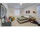 Spacious bedroom with unique decor, a comfy chair, and stylish furnishings at 4507 S 119Th Dr, Avondale, AZ 85323