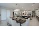 Stylish dining area with seating for eight with views into the living room and kitchen at 4507 S 119Th Dr, Avondale, AZ 85323