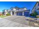 Charming two-story home with a three car garage, manicured lawn, and desert landscaping at 4507 S 119Th Dr, Avondale, AZ 85323