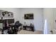 Game room with gaming setup, entertainment center, and wall-mounted TV at 4507 S 119Th Dr, Avondale, AZ 85323