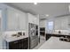 Contemporary kitchen boasting stainless steel appliances, quartz countertops, and ample cabinet space at 4507 S 119Th Dr, Avondale, AZ 85323