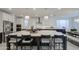 Elegant kitchen with an oversized island featuring pendant lighting and seating for four at 4507 S 119Th Dr, Avondale, AZ 85323