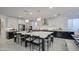 Well-designed kitchen featuring a large island with seating, quartz countertops, and stylish pendant lights at 4507 S 119Th Dr, Avondale, AZ 85323