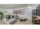 Relaxing living room featuring a comfortable gray sofa, marble coffee table, and stylish decor at 4507 S 119Th Dr, Avondale, AZ 85323