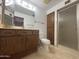 Bathroom featuring tile floors, vanity, toilet, and a glass-enclosed shower at 4537 E Emelita Ave, Mesa, AZ 85206