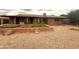 Beautiful brick home featuring gravel landscaping and a charming brick planter, offering a warm welcome to visitors at 4537 E Emelita Ave, Mesa, AZ 85206