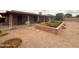 Charming brick home with gravel landscaping and a brick planter, offering a low-maintenance and inviting curb appeal at 4537 E Emelita Ave, Mesa, AZ 85206