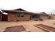 This charming brick home features an inviting driveway with low maintenance gravel landscaping and brick planters at 4537 E Emelita Ave, Mesa, AZ 85206