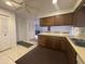 Spacious kitchen view featuring wooden cabinetry and tile flooring at 4537 E Emelita Ave, Mesa, AZ 85206