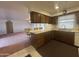 Kitchen area open to living space with bar stool seating at counter at 4537 E Emelita Ave, Mesa, AZ 85206