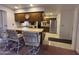 Well-appointed kitchen with ample counter space and a cozy breakfast bar area at 4537 E Emelita Ave, Mesa, AZ 85206