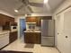 Traditional kitchen featuring brown cabinets and stainless steel appliances at 4537 E Emelita Ave, Mesa, AZ 85206