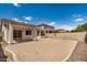 Spacious backyard featuring a large patio area and low-maintenance landscaping, perfect for outdoor entertaining at 4891 E Meadow Mist Ln, San Tan Valley, AZ 85140