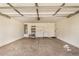 The garage offers space for vehicles and storage with white cabinets at 4891 E Meadow Mist Ln, San Tan Valley, AZ 85140