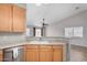 A bright kitchen showcases stainless appliances and a breakfast bar for dining at 4891 E Meadow Mist Ln, San Tan Valley, AZ 85140