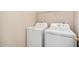 Laundry room includes a washing machine and a dryer at 4891 E Meadow Mist Ln, San Tan Valley, AZ 85140