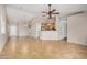 Spacious living room with tile floors, ceiling fan, and bright, open layout at 4891 E Meadow Mist Ln, San Tan Valley, AZ 85140