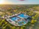 Community aerial view featuring swimming pools, a playground, and shaded seating areas at 4960 E Colonial Dr, Chandler, AZ 85249