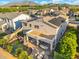 Aerial view of a home with a pool, outdoor kitchen, and mountain views, ideal for luxury living at 4960 E Colonial Dr, Chandler, AZ 85249