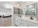Elegant bathroom features double vanity, modern fixtures, and marble tile, with a large mirror at 4960 E Colonial Dr, Chandler, AZ 85249
