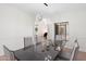Elegant dining room with modern chandelier and seating for six at 4960 E Colonial Dr, Chandler, AZ 85249