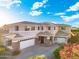 Stunning two-story home with a well-manicured lawn and a spacious driveway, showcasing curb appeal at 4960 E Colonial Dr, Chandler, AZ 85249