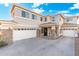 Stunning two-story home with a wide driveway and inviting entrance, perfect for Gathering living at 4960 E Colonial Dr, Chandler, AZ 85249