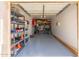 View of a well-organized garage with storage shelves, providing ample space for vehicles and storage at 4960 E Colonial Dr, Chandler, AZ 85249