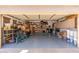 View of a clean and spacious garage with storage cabinets, providing ample space for vehicles and storage at 4960 E Colonial Dr, Chandler, AZ 85249