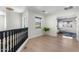 Bright hallway with hardwood floors, a window view, and a charming vase at 4960 E Colonial Dr, Chandler, AZ 85249
