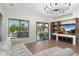 Bright living room with stone accent wall, large windows, and comfortable white sofa at 4960 E Colonial Dr, Chandler, AZ 85249