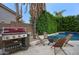 Backyard featuring outdoor grill and fire pit with comfortable seating for relaxing in style at 5672 E Beverly Ln, Scottsdale, AZ 85254
