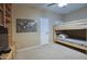 This room features a wooden bunk bed, carpeted floors, and ample space for a comfortable living at 5672 E Beverly Ln, Scottsdale, AZ 85254