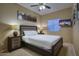 Cozy bedroom with a comfortable bed, nightstands, lamps, and soft lighting for a restful ambiance at 5672 E Beverly Ln, Scottsdale, AZ 85254