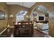 Elegant dining area with hardwood floors and a unique chandelier, connecting to the living space at 5672 E Beverly Ln, Scottsdale, AZ 85254