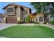 Charming two-story home features a well-manicured lawn and inviting curb appeal at 5672 E Beverly Ln, Scottsdale, AZ 85254