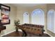 Fun game room featuring a foosball table and arched windows at 5672 E Beverly Ln, Scottsdale, AZ 85254