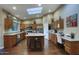 Spacious kitchen featuring a center island, stainless steel appliances, and ample cabinet space at 5672 E Beverly Ln, Scottsdale, AZ 85254