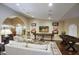 Open living area with hardwood floors, comfortable seating, and a media center at 5672 E Beverly Ln, Scottsdale, AZ 85254
