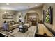 Open-concept living room and dining area with hardwood floors and neutral décor at 5672 E Beverly Ln, Scottsdale, AZ 85254