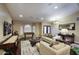 Spacious living room with a large rug, plush sofas, and plenty of natural light at 5672 E Beverly Ln, Scottsdale, AZ 85254