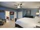 Main bedroom with an ensuite bathroom, plush armchair, and neutral-toned carpeting for added comfort at 5672 E Beverly Ln, Scottsdale, AZ 85254