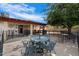 Enjoy outdoor dining on the backyard patio complete with outdoor seating and beautiful landscape at 5808 W Acoma Dr, Glendale, AZ 85306