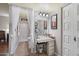 This spacious bathroom features a vanity with storage, framed mirror, and shower with white curtain at 5808 W Acoma Dr, Glendale, AZ 85306