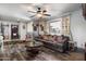 Cozy living room features stylish decor, a large sofa, and views to the entry and adjacent dining room at 5808 W Acoma Dr, Glendale, AZ 85306