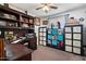 Organized office with built-in shelves and a desk area, ideal for a productive workspace at 5808 W Acoma Dr, Glendale, AZ 85306